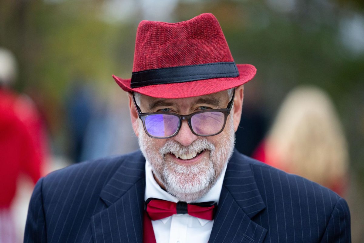 Kevin Mays from the Alumni Board of Directors and homecoming float judge walks down the Avenue of Champions judging each float before the WKU Homecoming Parade in Bowling Green on Friday, Nov. 15, 2024. 