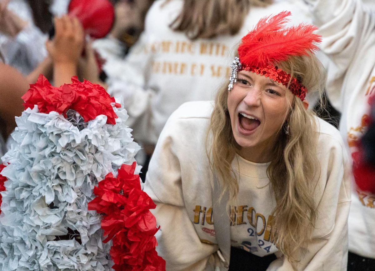 Chi Omega senior Lainey Thomas screams to show her spirit before the WKU Homecoming Parade in Bowling Green on Friday, Nov. 15, 2024. 