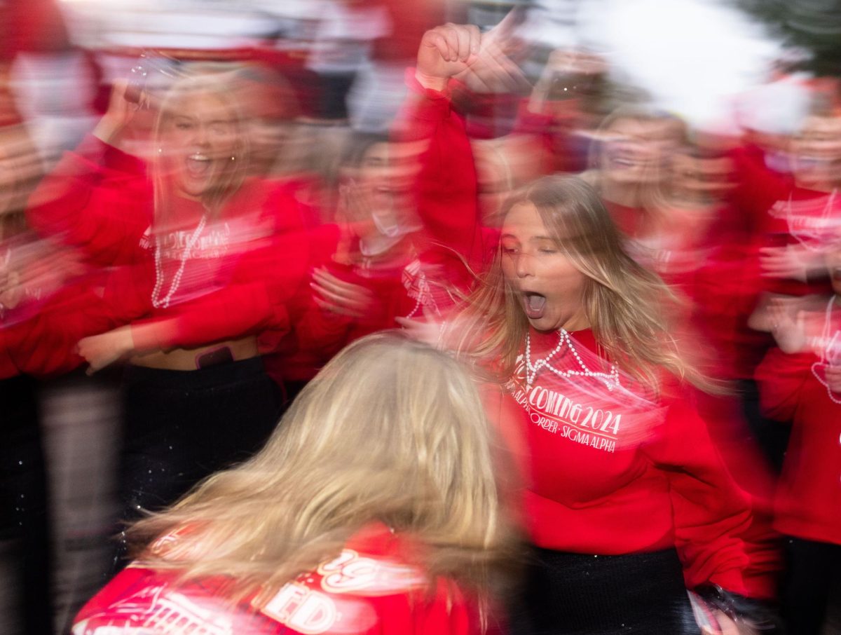 Phi Mu junior Lauren Davenport dances before the WKU Homecoming Parade in Bowling Green on Friday, Nov. 15, 2024. 