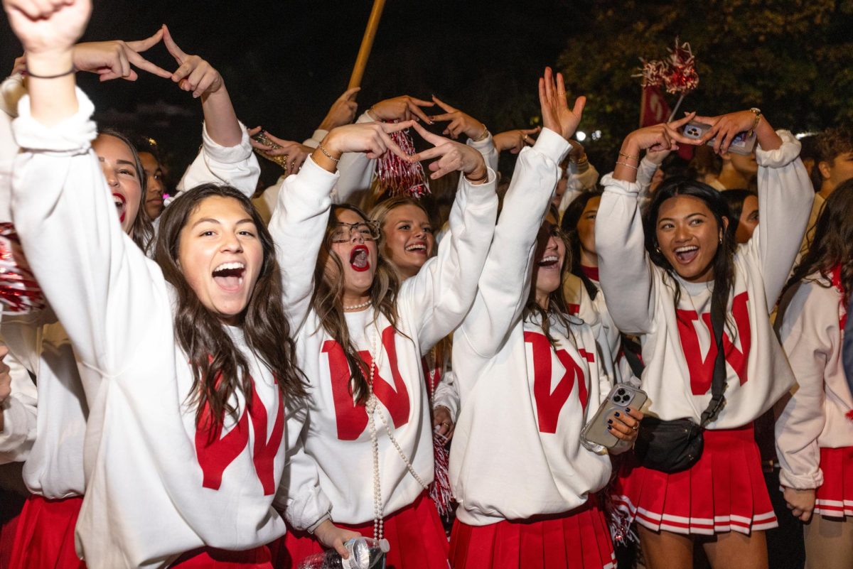 From left: Emily Feria, Riley Jaggers, Maggie Blair, Amaya Salvador of Alpha Delta Pi dance during the Big Red Roar celebration in Fountain Square Park after the WKU Homecoming Parade on Friday, Nov. 15, 2024. 