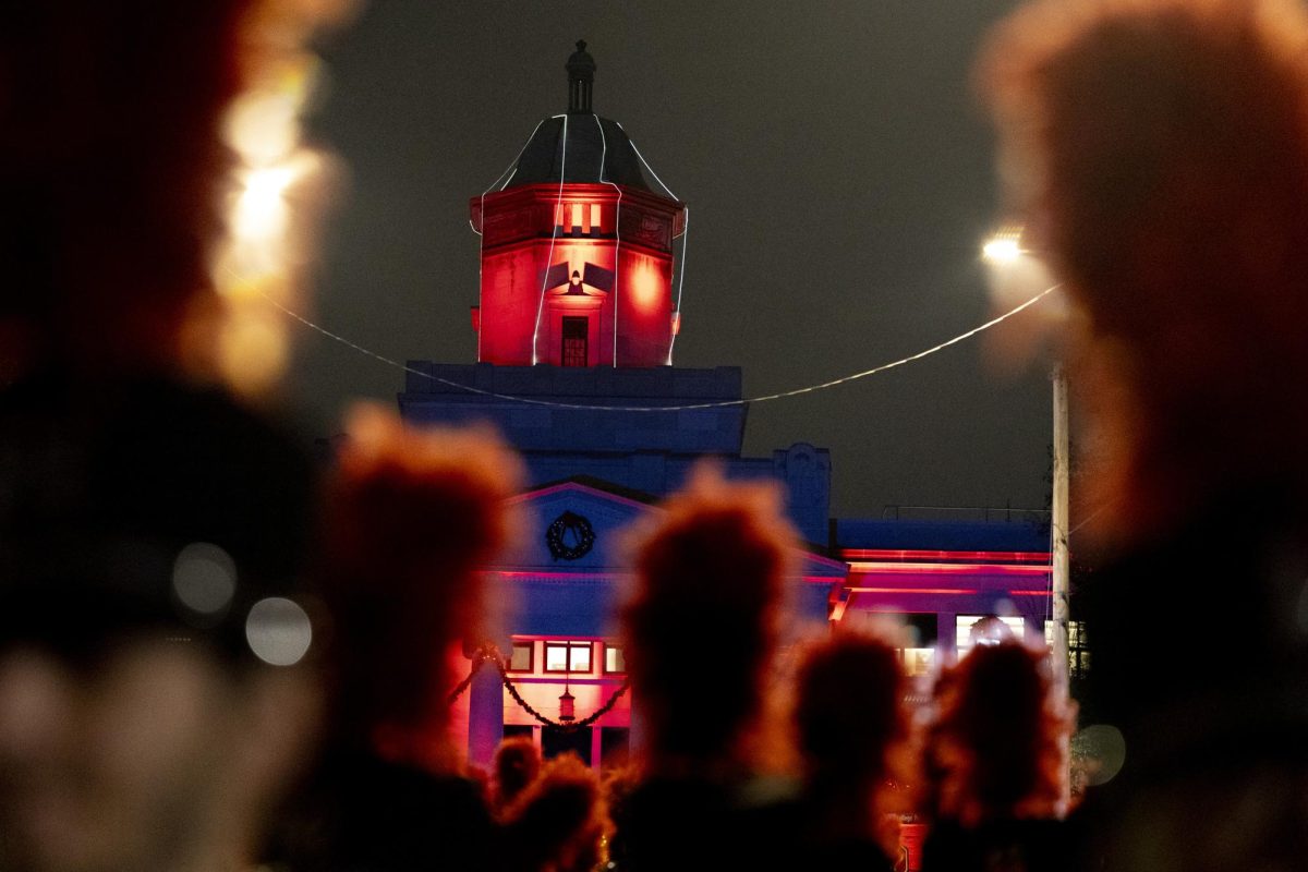 The Big Red Marching Band lines up on College St. in front of a decorated Cherry Hall before starting off the night with Western’s “Stand Up and Cheer” at WKU’s Roaring Red Homecoming Parade on Friday, Nov. 15, 2024. 