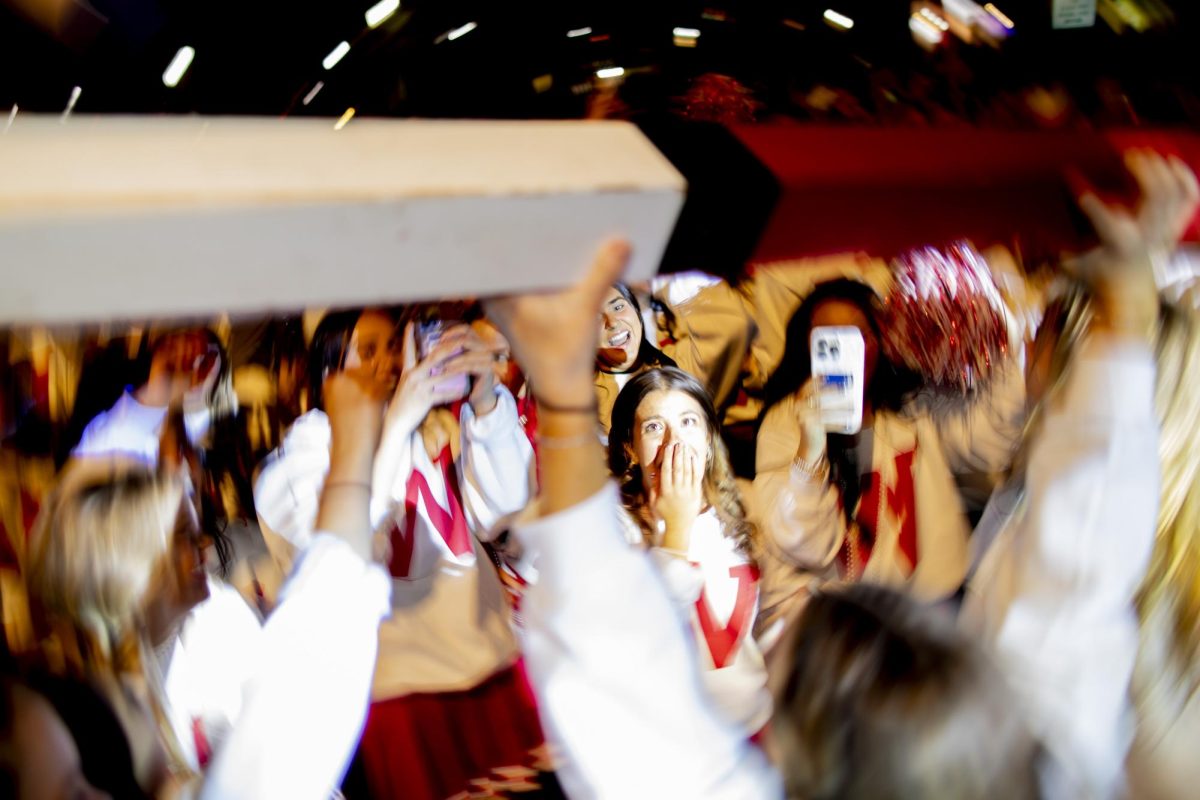 Members of Alpha Delta Pi sorority cheer in excitement and disbelief as overall homecoming chair, Riley Jaggers, presents the coveted spirit stick during the Big Red Roar after WKU’s “Roaring Red” Homecoming Parade on Friday, Nov. 15, 2024. 