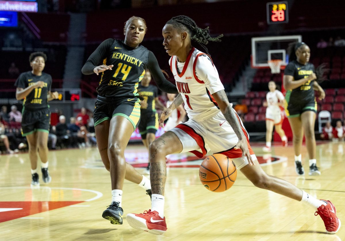 WKU guard Destiny Salary drives to the basket against opposition from Kentucky State’s Amyah Adair-Mars during WKU’s game against Kentucky State University on Saturday, Nov. 9, 2024 in Diddle Arena. 