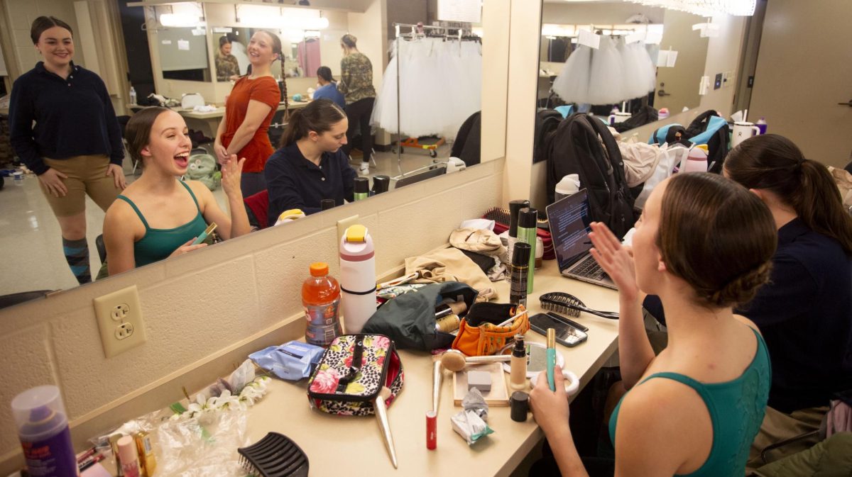 From left: Emilie Alyward, Maya Elfrink, Lindy Fischer and Shannon Maloney laugh while getting ready in the Van Meter Hall dressing room in preparation for the 2024 WinterDance rehearsal on Nov. 13, 2024. 