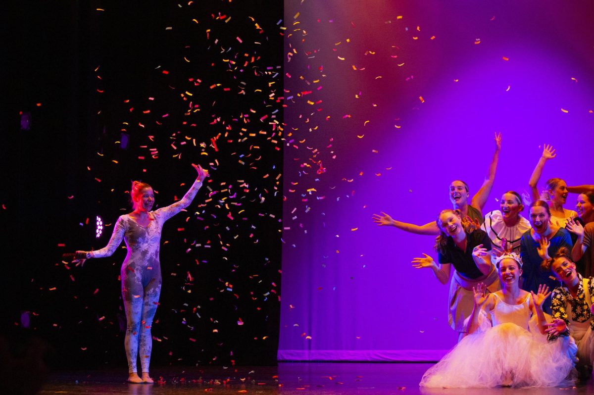 Madelyn Groth ends the 2024 Winter Dance rehearsal after popping confetti during the finale at Van Meter Hall on Nov. 13, 2024.