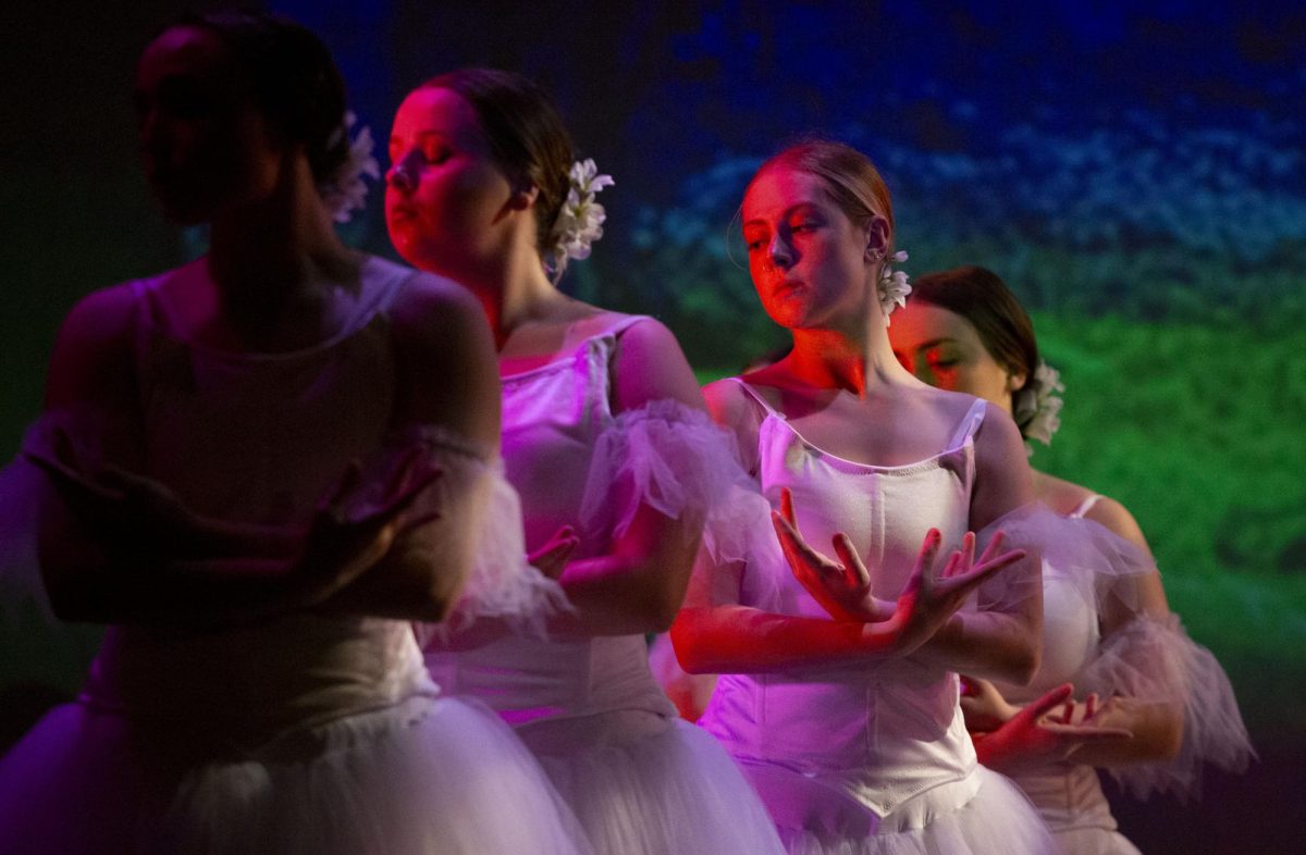 From left: Elly Ireland, Darcy Mraz and Emelie Aylward perform during the 2024 WinterDance rehearsal at Van Meter Hall on Nov. 13, 2024. 