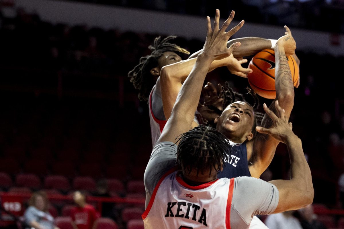 Jackson State guard Jayme Mitchell Jr. (3) has the ball stripped from behind on a mid-court shot attempt by WKU’s Jalen Jackson (3) with Blaise Keita (1) blocking the route to the rim during WKU’s game against the Jackson State Tigers on Wednesday, Nov. 20, 2024 in E.A. Diddle Arena. 