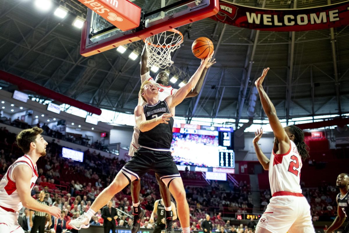 Lipscomb guard Will Pruitt’s (2) layup attempt is stopped by Babacar Faye (5) and Enoch Kalambay (23) during WKU’s game against Lipscomb on Sunday, Nov. 17, 2024 in E.A. Diddle Arena. 