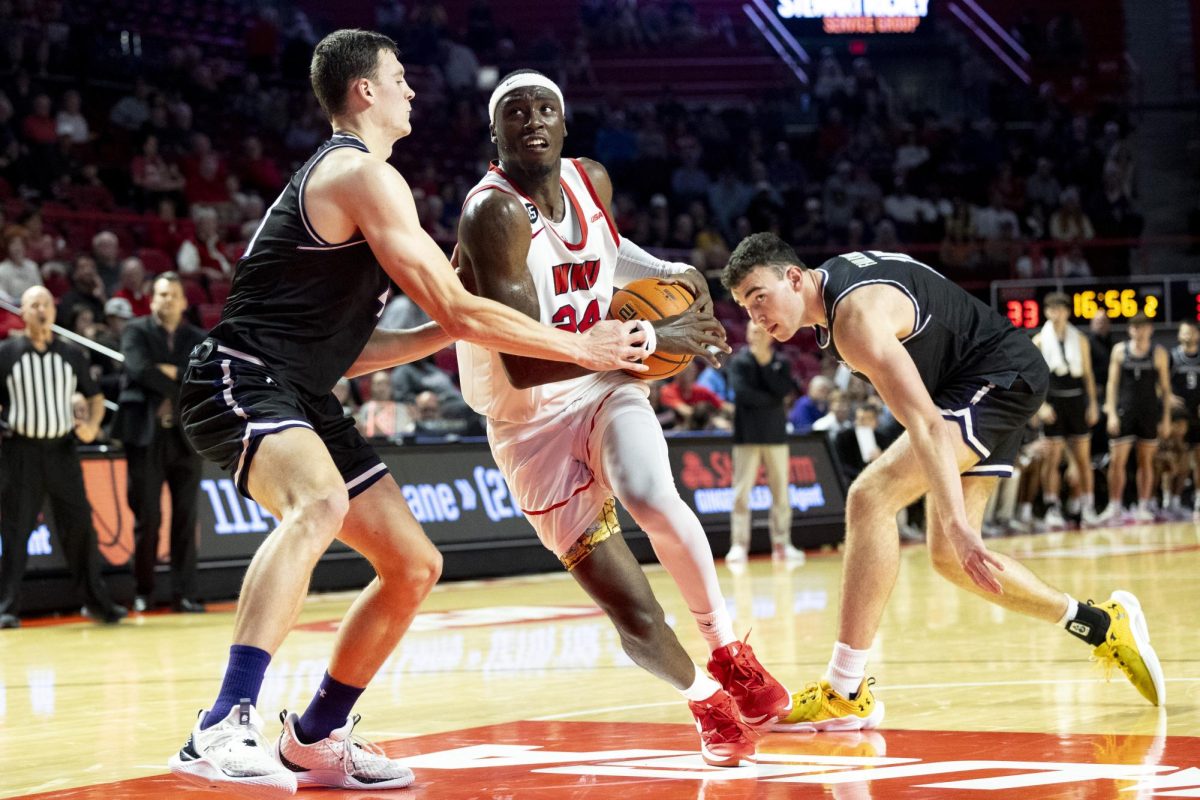 Forward Tyrone Marshall Jr. (24) splits defenders on a drive to the basket during WKU’s win against Lipscomb on Sunday, Nov. 17, 2024 in E.A. Diddle Arena. 