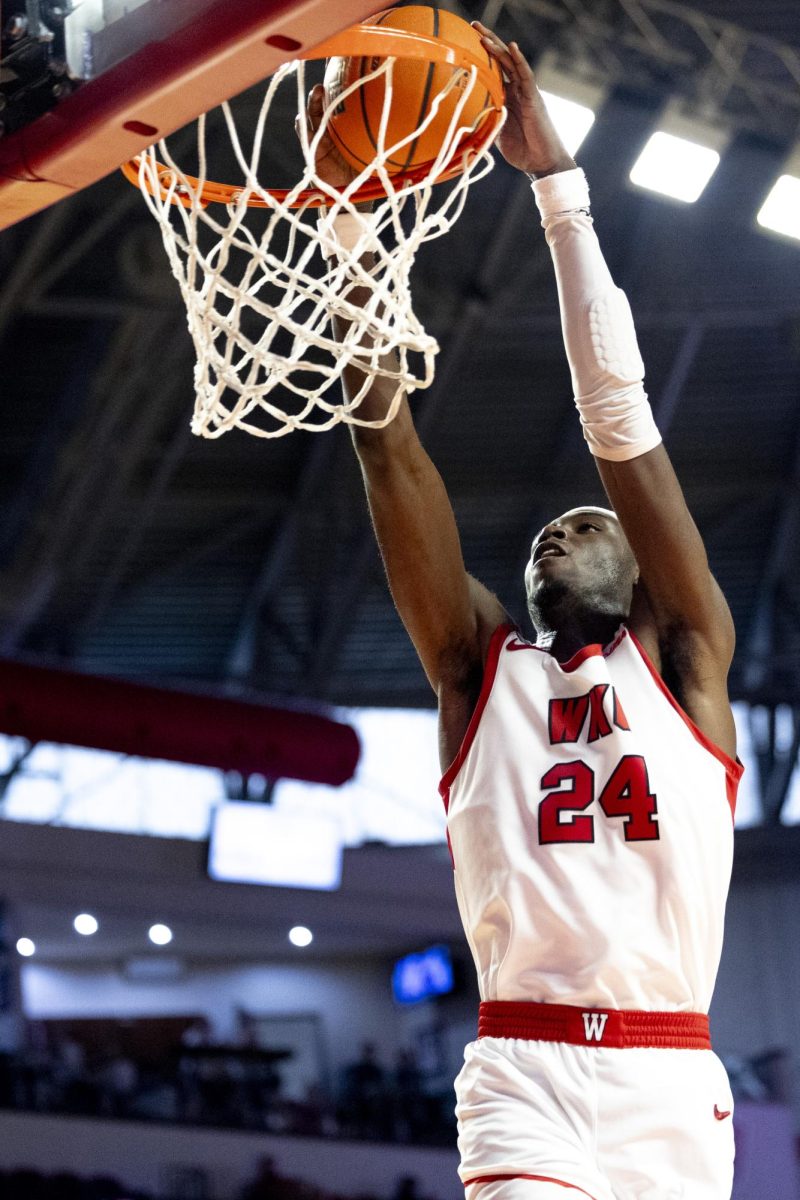 Forward Tyrone Marshall Jr. (24) drops the ball in the basket on a breakaway drive during WKU’s win against Lipscomb on Sunday, Nov. 17, 2024 in E.A. Diddle Arena. 