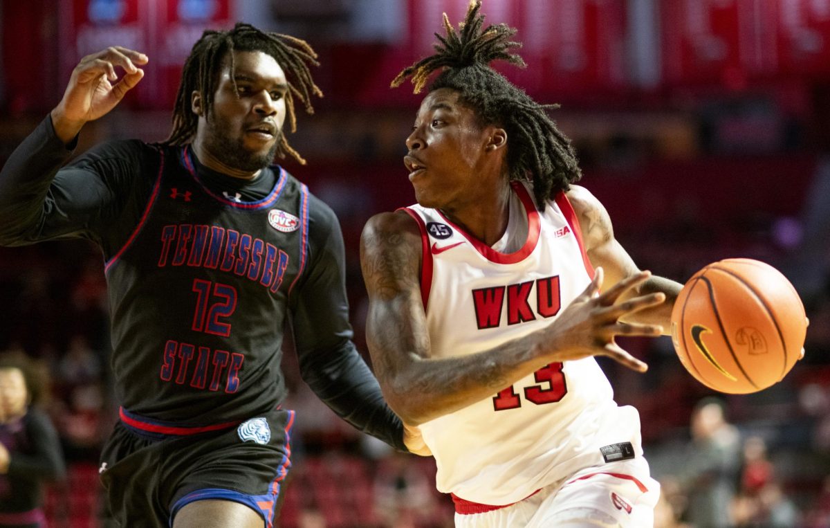 WKU guard Julius Thedford (13) drives the ball to the basketball during the Hilltopper's game against Tennessee State University in Bowling Green, Ky. on Tuesday, Dec. 10, 2024.