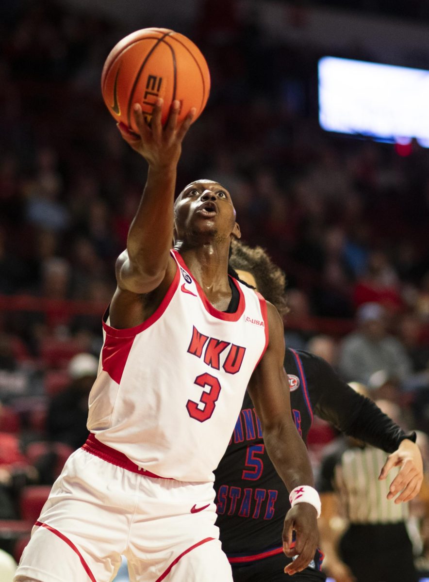 WKU guard Khristian Lander (4) drives the ball during the Hilltopper's game against Tennessee State University in Bowling Green, Ky. on Tuesday, Dec. 10, 2024.