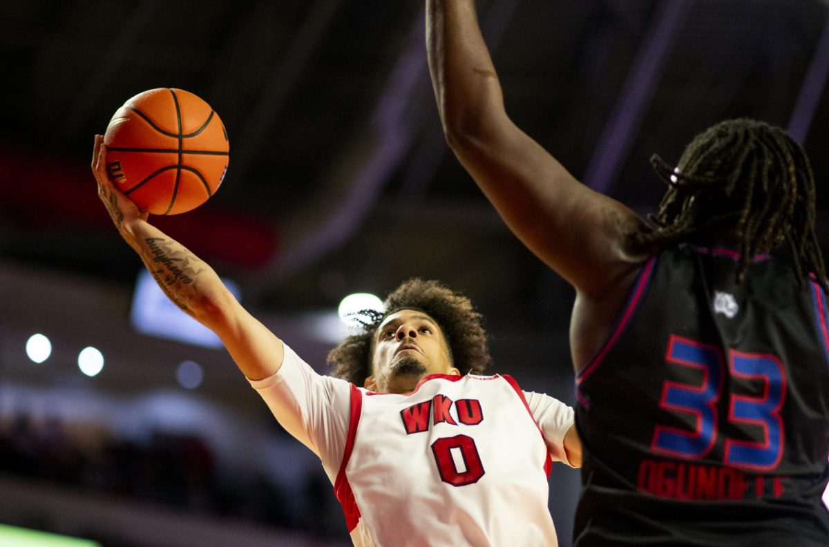 WKU guard Braxton Bayless (0) attempts a layup during the Hilltopper's game against Tennessee State University in Bowling Green, Ky. on Tuesday, Dec. 10, 2024.