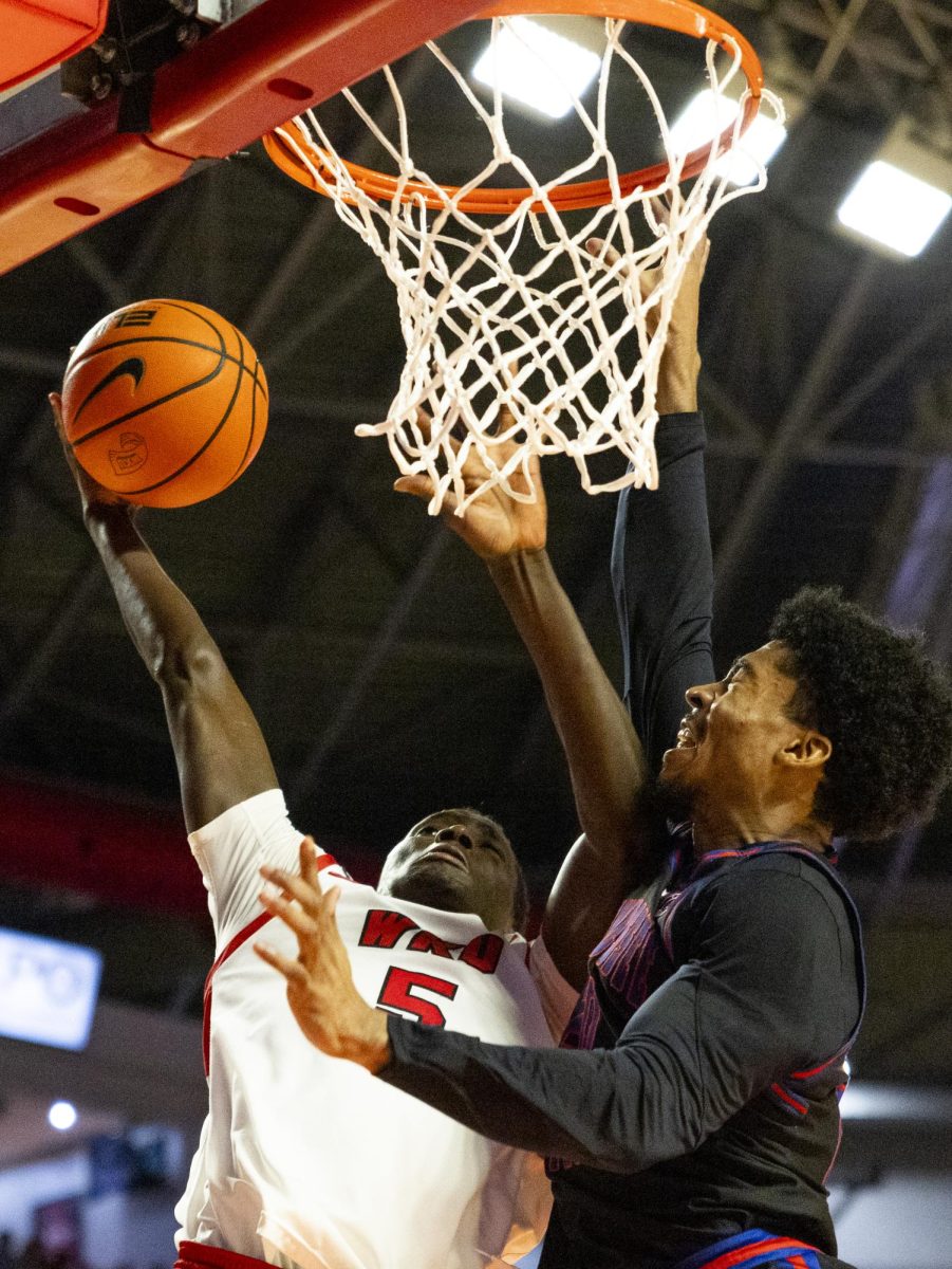 WKU guard Babacar Faye (5) attempts a layup during the Hilltopper's game against Tennessee State University in Bowling Green, Ky. on Tuesday, Dec. 10, 2024.