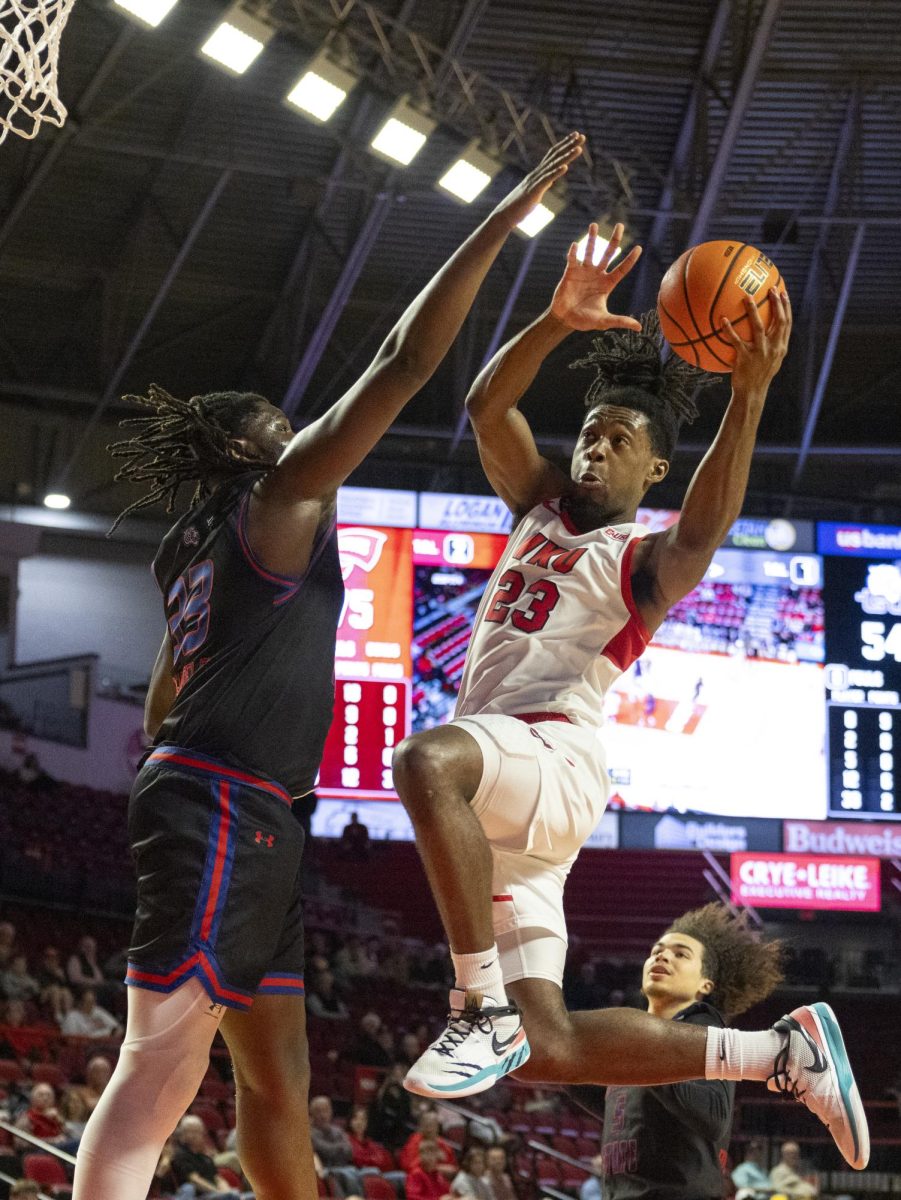 WKU guard Enoch Kalambay (23) drives the ball and shoots during the Hilltopper's game against Tennessee State University in Bowling Green, Ky. on Tuesday, Dec. 10, 2024.