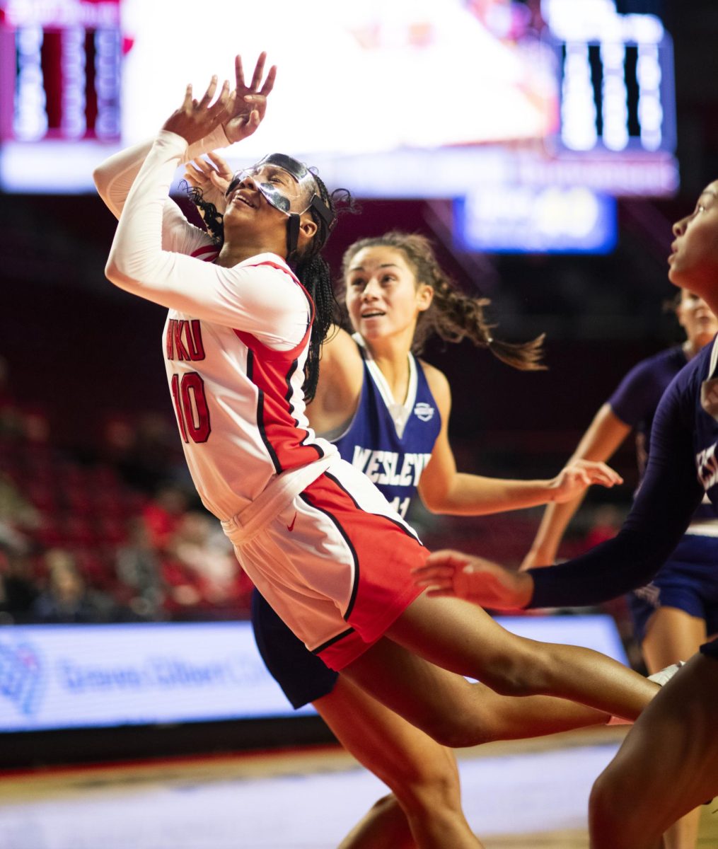 WKU guard Acacia Hayes (10) draws a foul during the Lady Topper's game against the Kentucky Wesleyan Panthers in Bowling Green, Ky. on Wednesday, Dec. 11, 2024.