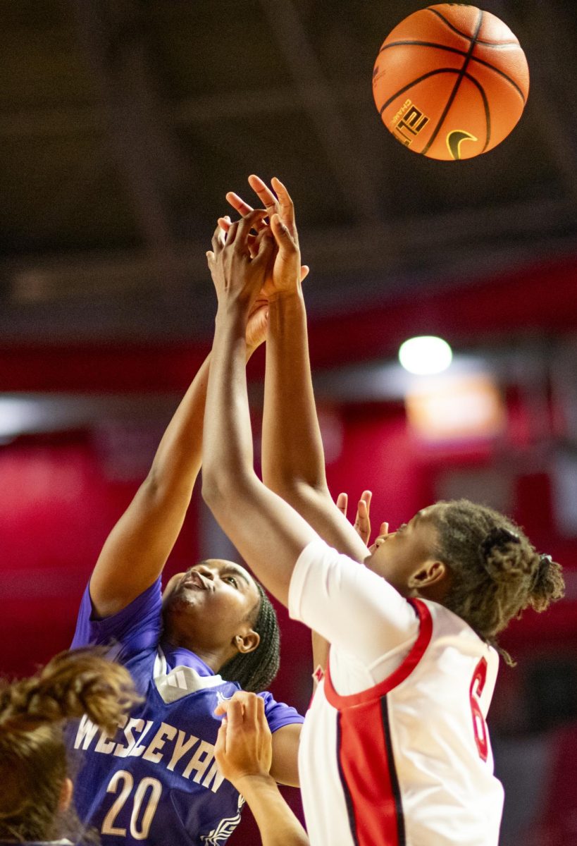 WKU forward Mariama Sow (6) and Kentucky Wesleyan guard Shiya Hoosier (20) fight for the ball during the Lady Topper's game against the Kentucky Wesleyan Panthers in Bowling Green, Ky. on Wednesday, Dec. 11, 2024.