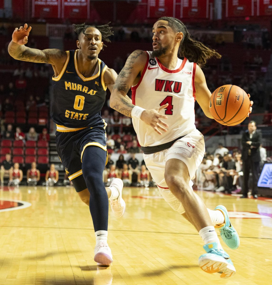 WKU guard Khristian Lander (4) drives the ball during the Hilltopper's game against the Murray State Racers in Bowling Green, Ky. on Saturday, Dec. 14, 2024.