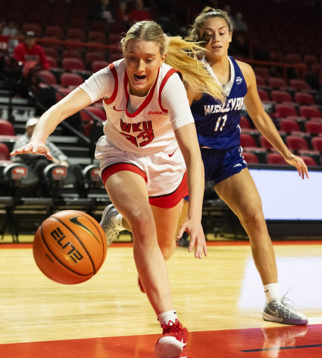 WKU guard Josie Gilvin (33) scrambles for the ball during the Lady Topper's game against the Kentucky Wesleyan Panthers in Bowling Green, Ky. on Wednesday, Dec. 11, 2024.