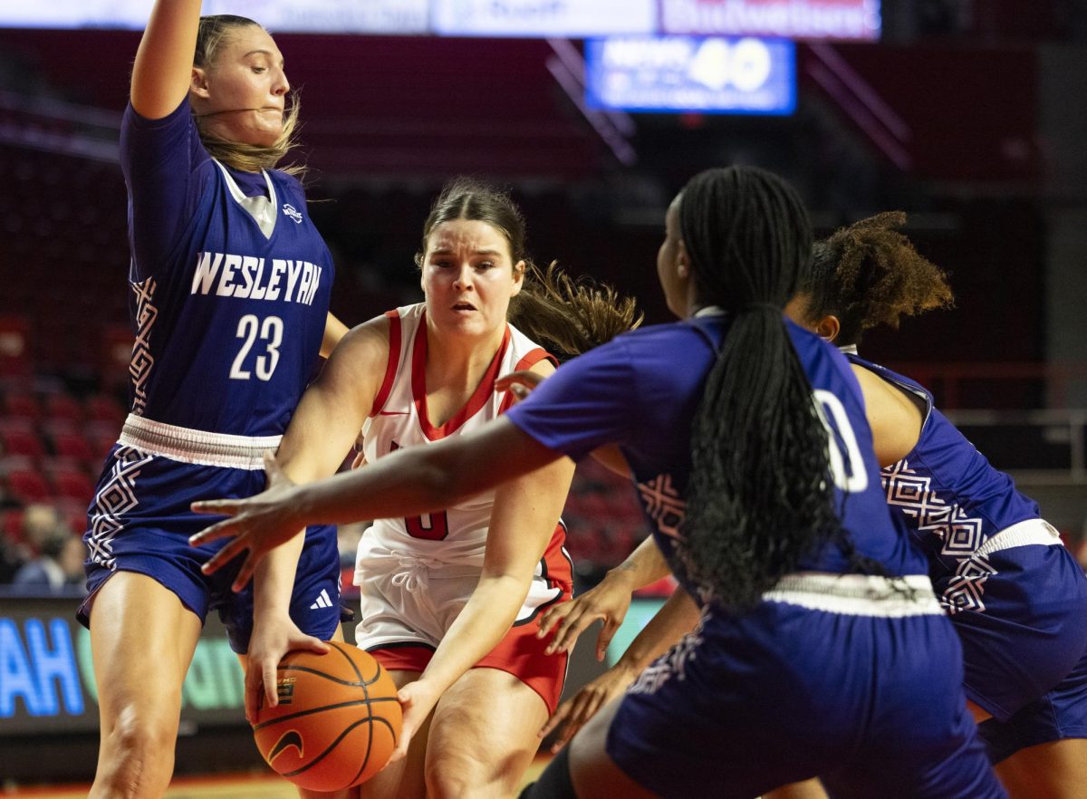 WKU guard Mackenzie Chatfield (0) fights off defenders during the Lady Topper's game against the Kentucky Wesleyan Panthers in Bowling Green, Ky. on Wednesday, Dec. 11, 2024.