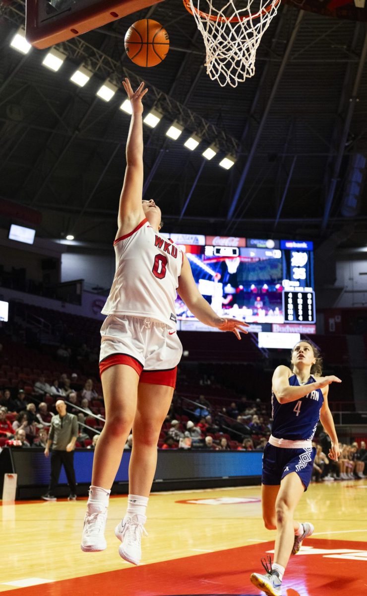 WKU guard Mackenzie Chatfield (0) makes a layup during the Lady Topper's game against the Kentucky Wesleyan Panthers in Bowling Green, Ky. on Wednesday, Dec. 11, 2024.