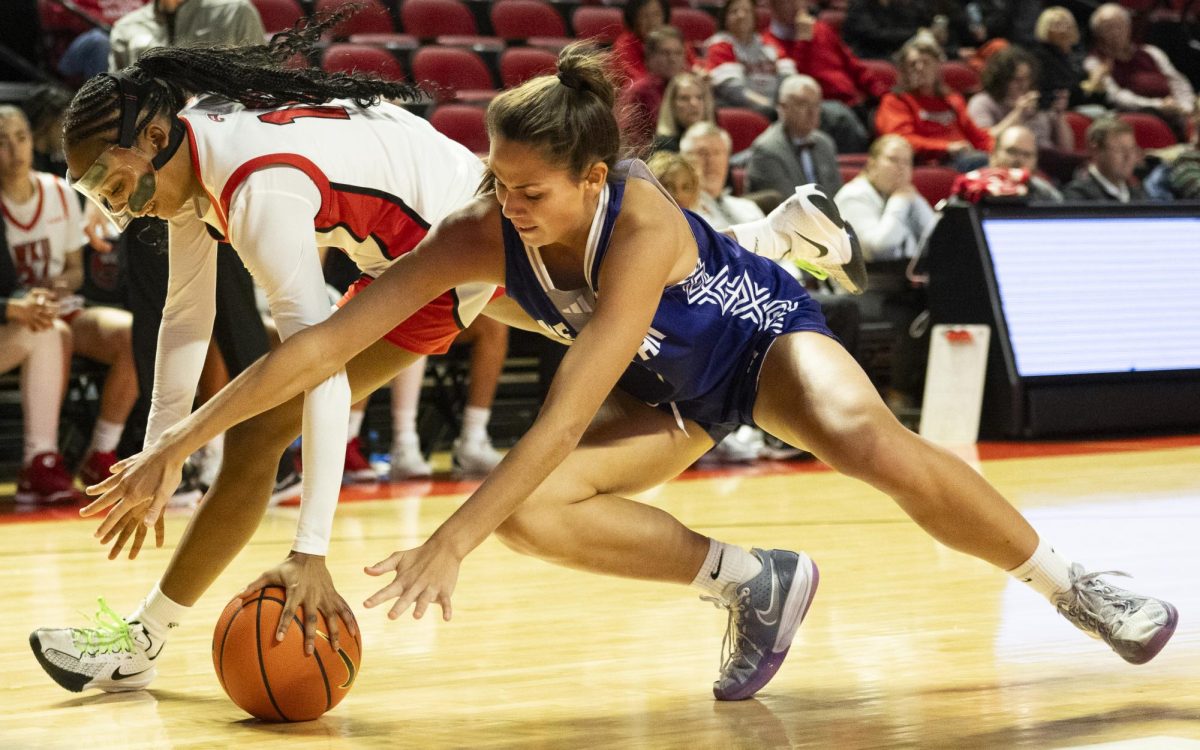 WKU guard Acacia Hayes (10) fight for a loose ball during the Lady Topper's game against the Kentucky Wesleyan Panthers in Bowling Green, Ky. on Wednesday, Dec. 11, 2024.