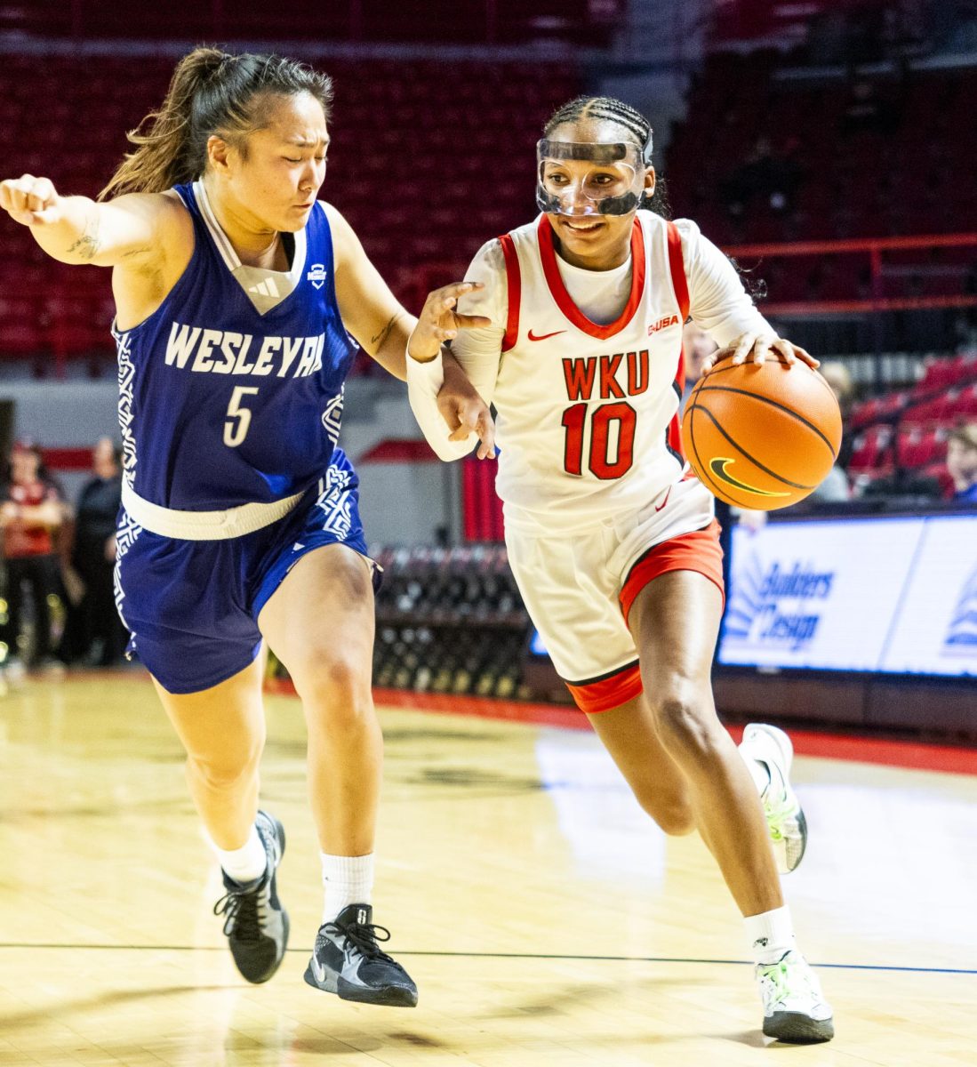 WKU guard Acacia Hayes (10) drives the ball during the Lady Topper's game against the Kentucky Wesleyan Panthers in Bowling Green, Ky. on Wednesday, Dec. 11, 2024.