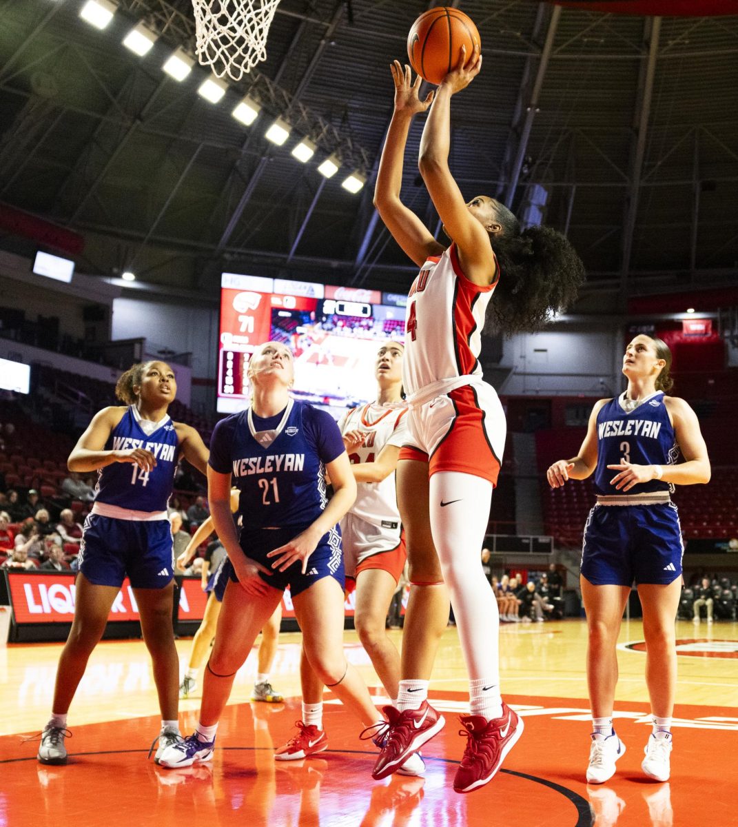 WKU forward Caleigh-Rose West (4) makes a layup during the Lady Topper's game against the Kentucky Wesleyan Panthers in Bowling Green, Ky. on Wednesday, Dec. 11, 2024.