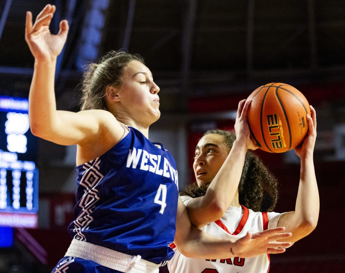 WKU guard Salma Khedr (34) fights off a defender during the Lady Topper's game against the Kentucky Wesleyan Panthers in Bowling Green, Ky. on Wednesday, Dec. 11, 2024.