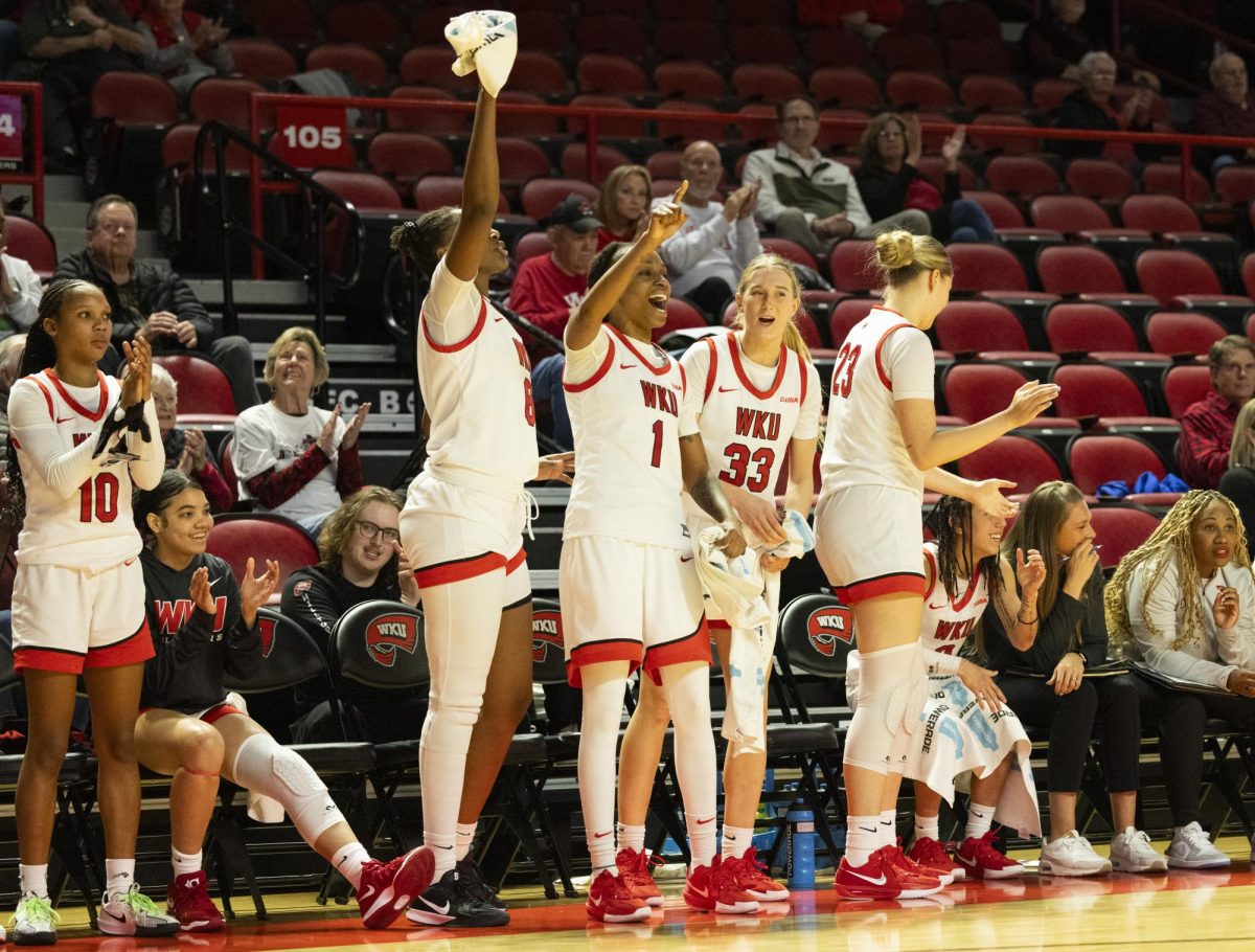 The Lady Toppers bench celebrates a teammates defensive play during their game against the Kentucky Wesleyan Panthers in Bowling Green, Ky. on Wednesday, Dec. 11, 2024.