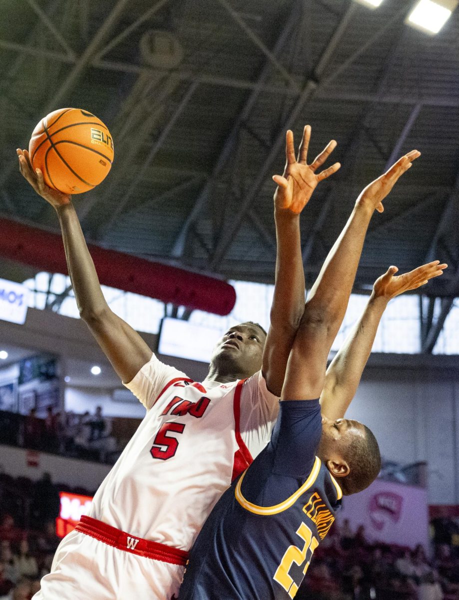 WKU forward Babacar Faye (5) attempts a layup during the Hilltopper's game against the Murray State Racers in Bowling Green, Ky. on Saturday, Dec. 14, 2024.