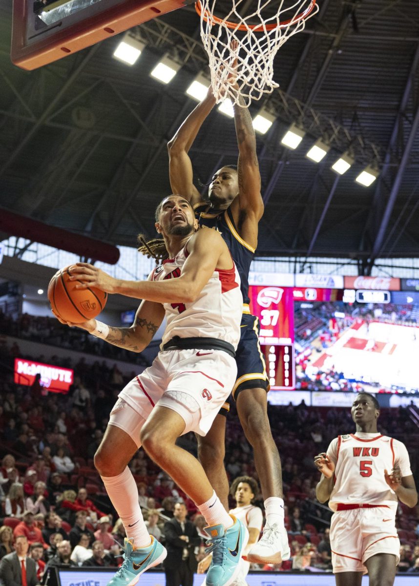 WKU guard Khristian Lander (4) attempts a layup during the Hilltopper's game against the Murray State Racers in Bowling Green, Ky. on Saturday, Dec. 14, 2024.