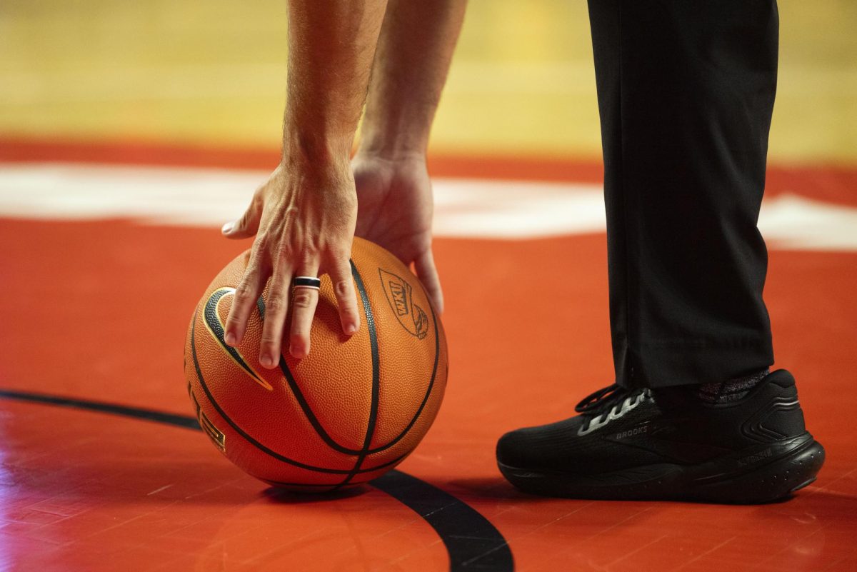 A referee picks up the ball during the Hilltopper's game against the Murray State Racers in Bowling Green, Ky. on Saturday, Dec. 14, 2024.