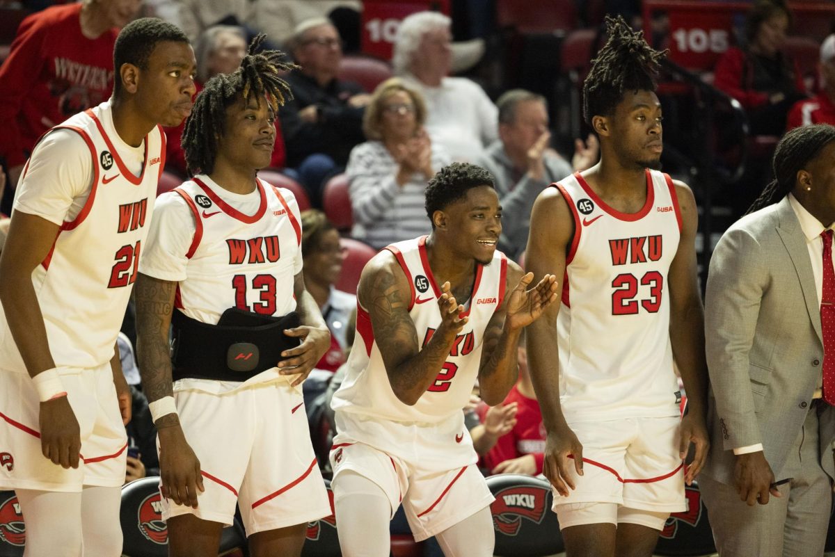 The WKU bench cheers on their teammates during the Hilltopper's game against the Murray State Racers in Bowling Green, Ky. on Saturday, Dec. 14, 2024.