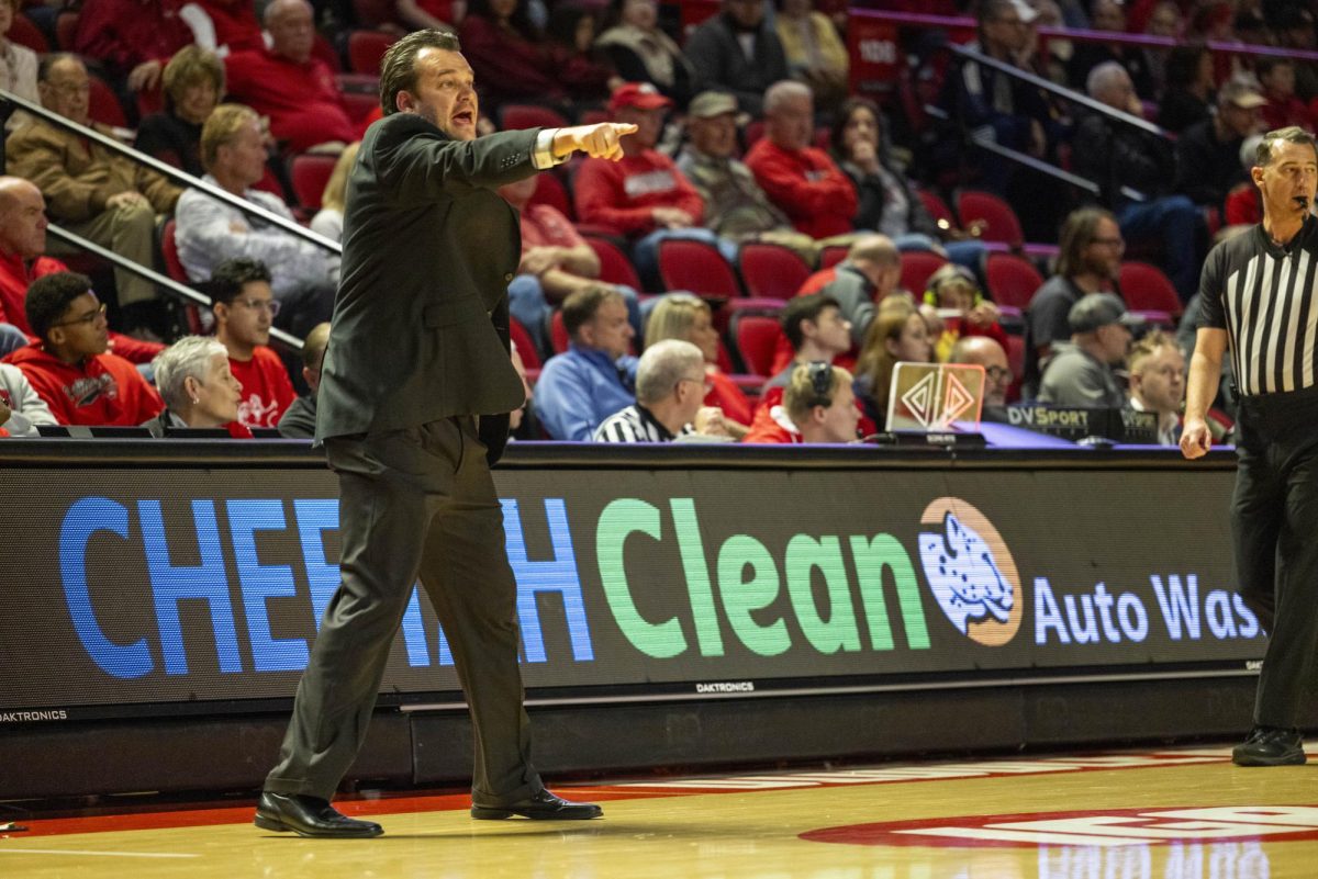 WKU head coach Hank Plona gestures to his team during the Hilltopper's game against the Murray State Racers in Bowling Green, Ky. on Saturday, Dec. 14, 2024.