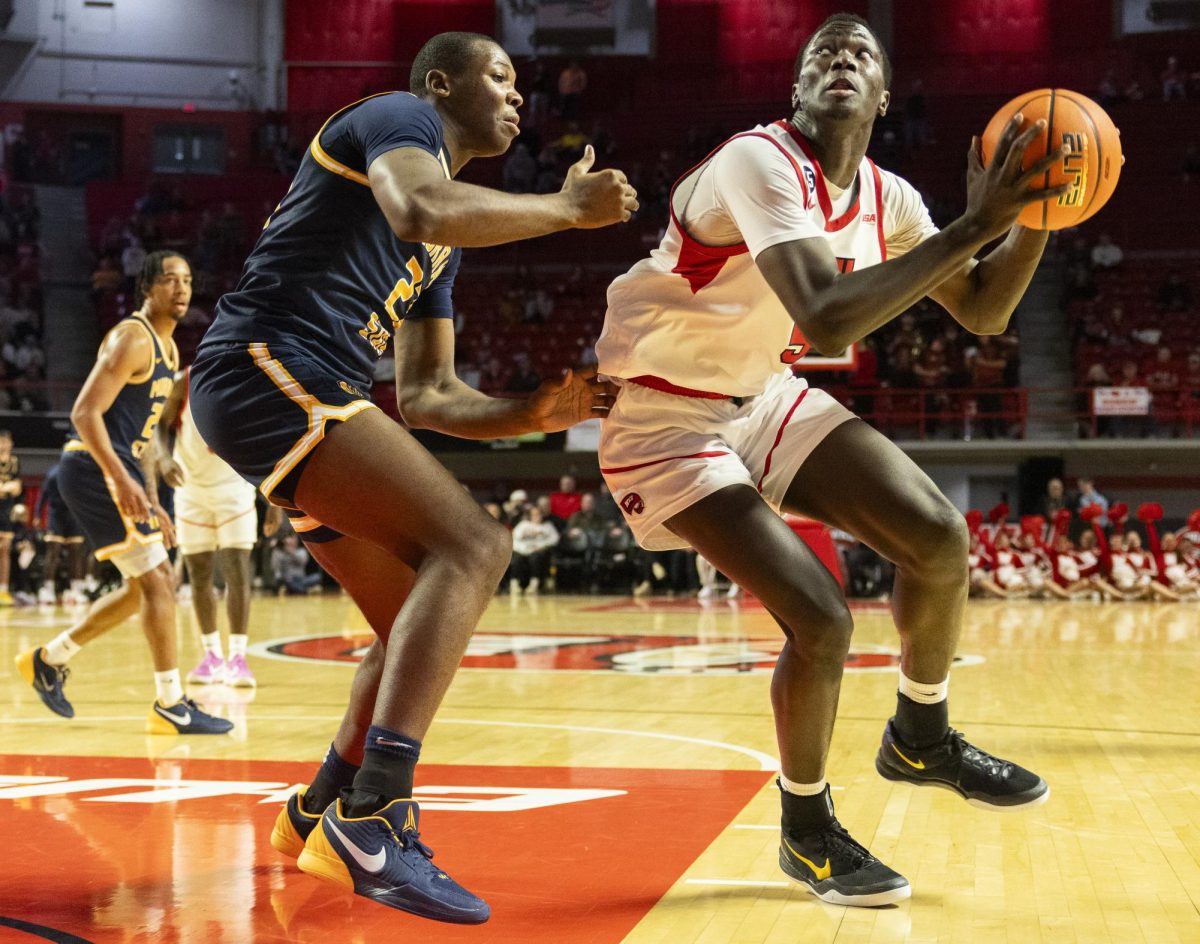 WKU forward Babacar Faye (5) fights his way to the basket during the Hilltopper's game against the Murray State Racers in Bowling Green, Ky. on Saturday, Dec. 14, 2024.