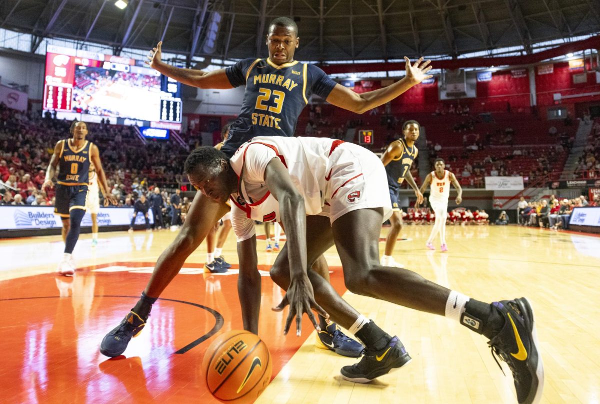 WKU forward Babacar Faye (5) scrambles for the ball during the Hilltopper's game against the Murray State Racers in Bowling Green, Ky. on Saturday, Dec. 14, 2024.