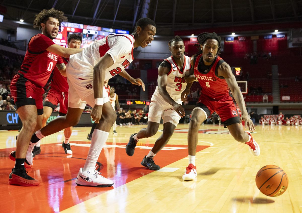 Players race for a loose ball during the Hilltopper's game against the Seattle Redhawks in Bowling Green, Ky. on Tuesday, Dec. 17, 2024.