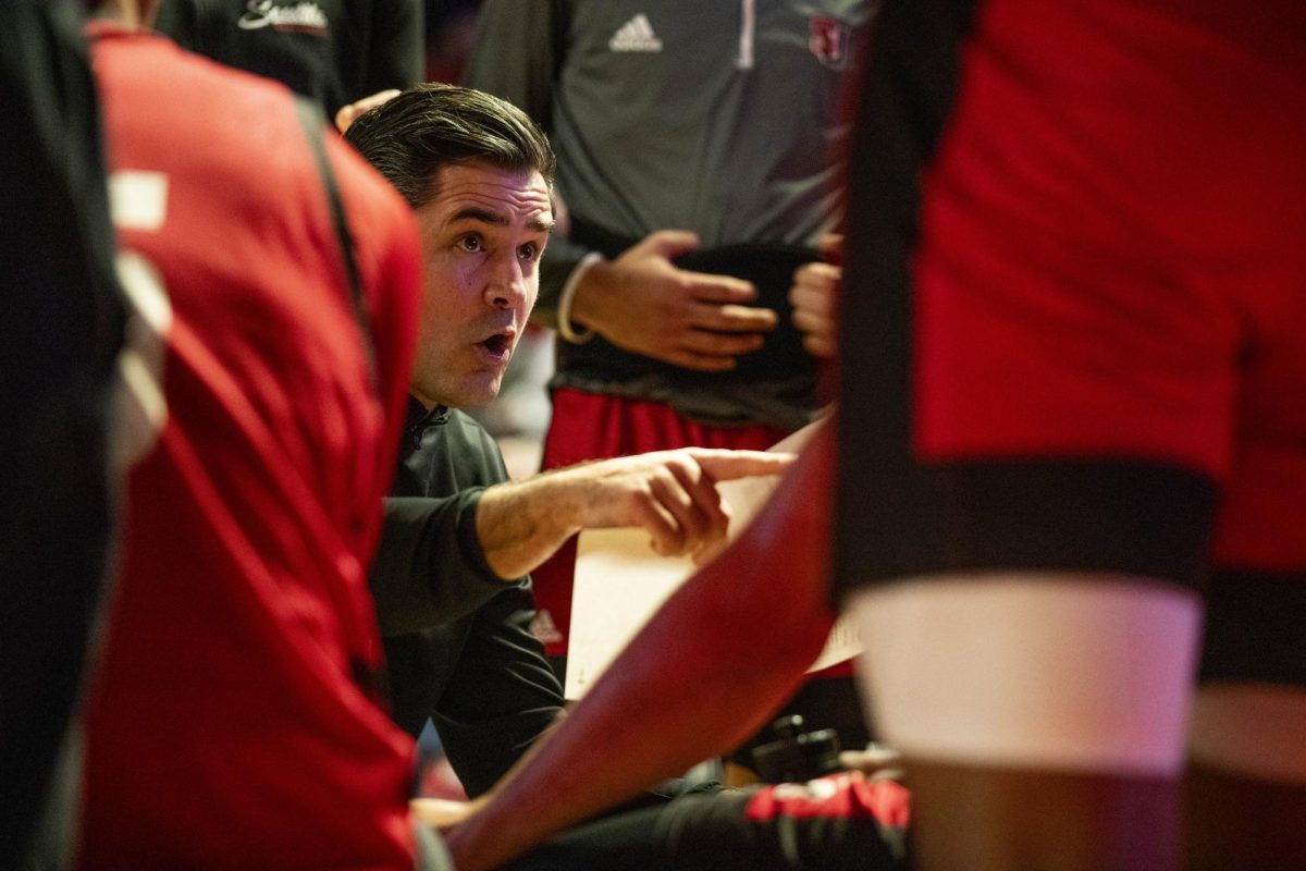 Redhawks head coach Chris Victor speaks to his team during a timeout during the Hilltopper's game against the Seattle Redhawks in Bowling Green, Ky. on Tuesday, Dec. 17, 2024.