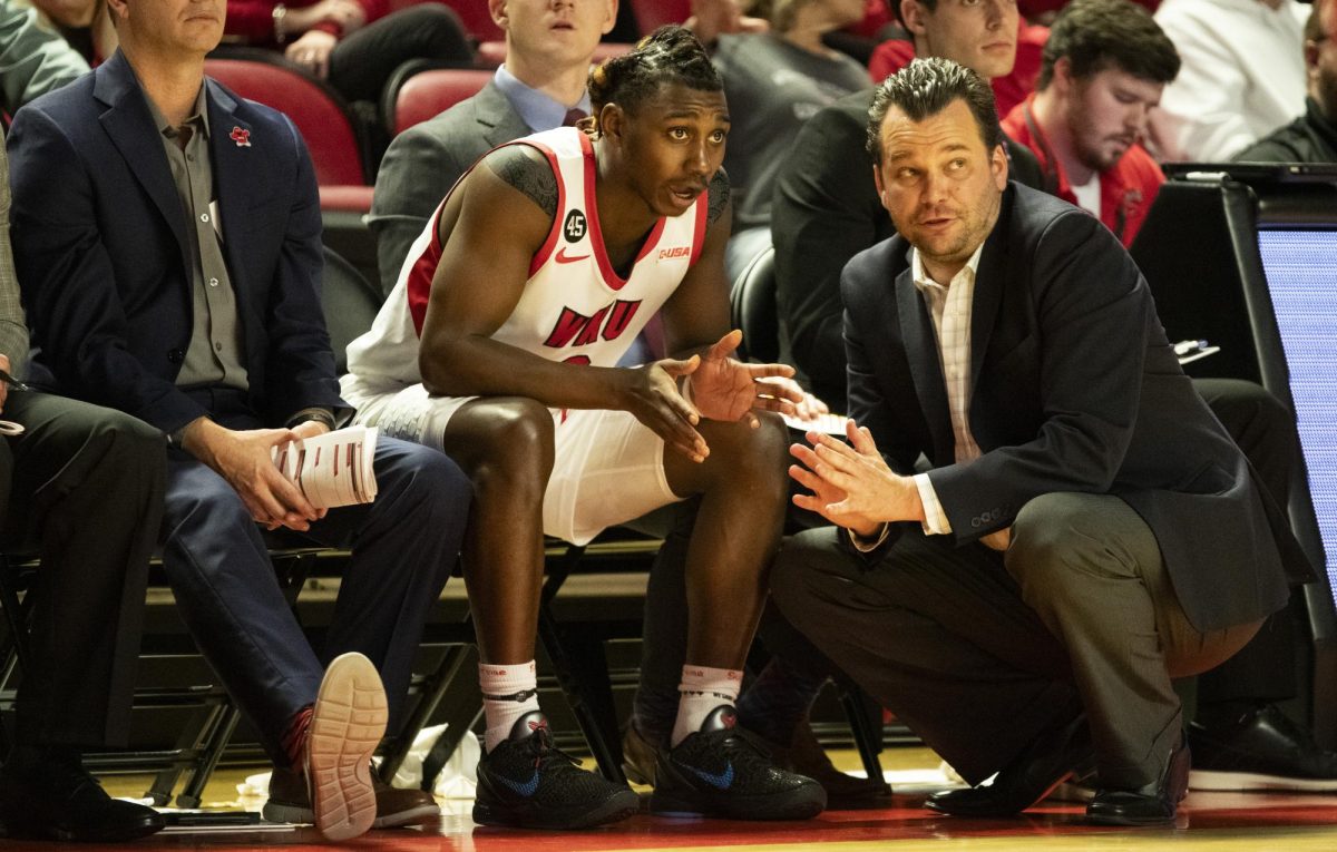 WKU head coach Hank Plona speaks to guard Jalen Jackson (3) during the Hilltopper's game against the Seattle Redhawks in Bowling Green, Ky. on Tuesday, Dec. 17, 2024.