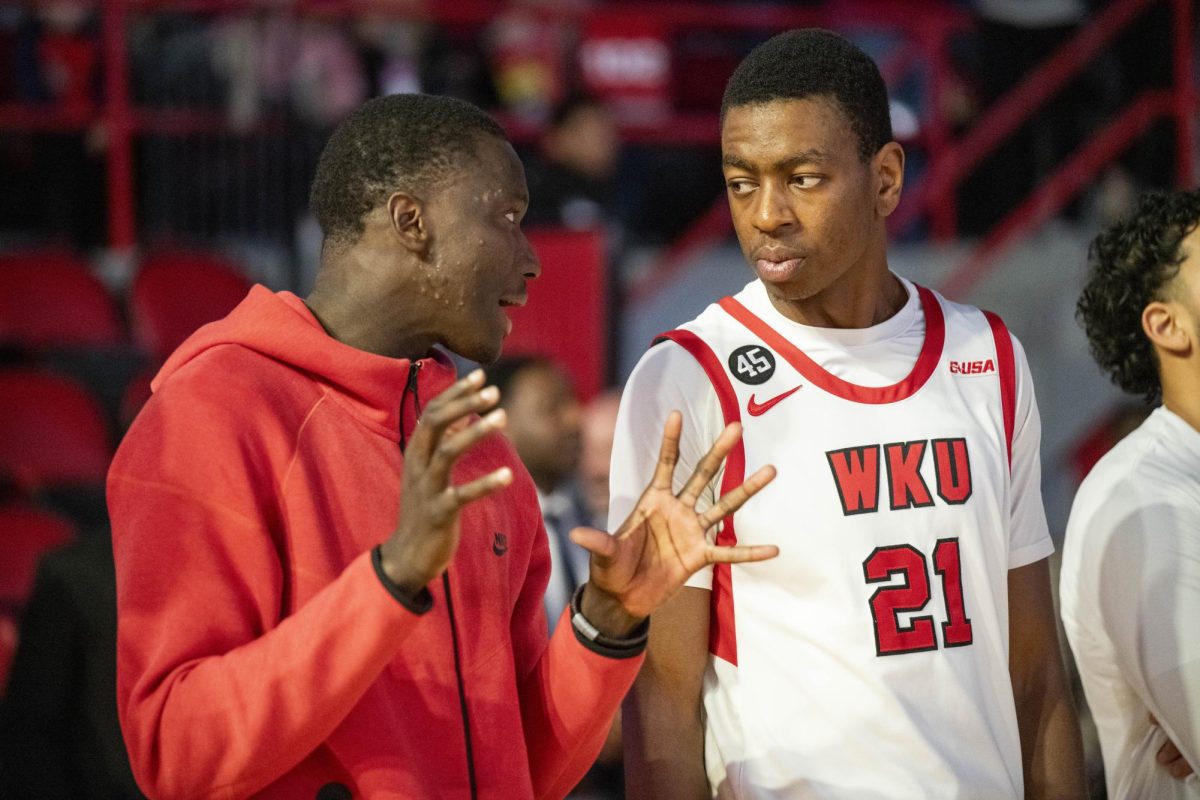 WKU forward Leeroy Odiahi (21) speaks to forward Babacar Faye (5) during the Hilltopper's game against the Kentucky Wesleyan Panthers in Bowling Green, Ky. on Saturday, Dec. 21, 2024.