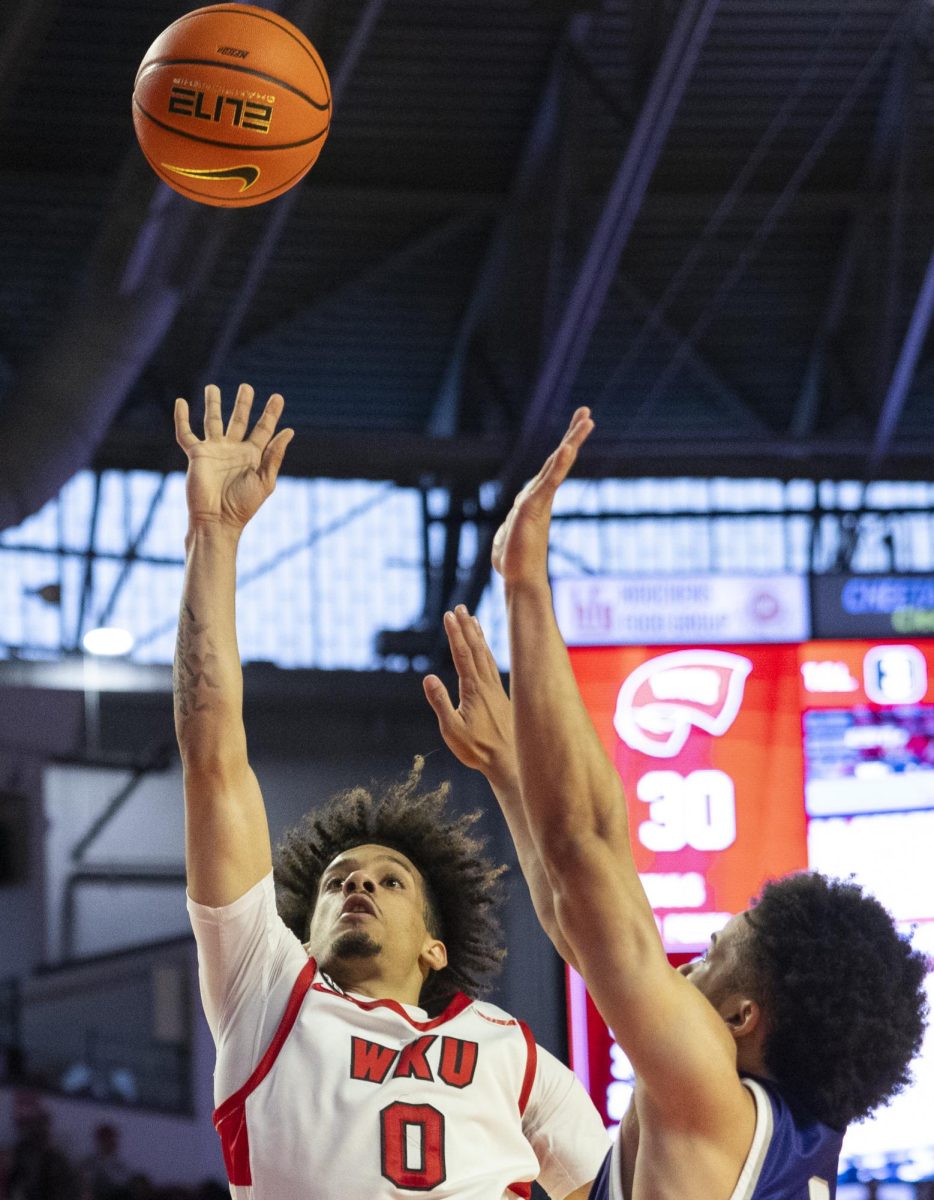 WKU guard Braxton Bayless (0) attempts a basket during the Hilltopper's game against the Kentucky Wesleyan Panthers in Bowling Green, Ky. on Saturday, Dec. 21, 2024.