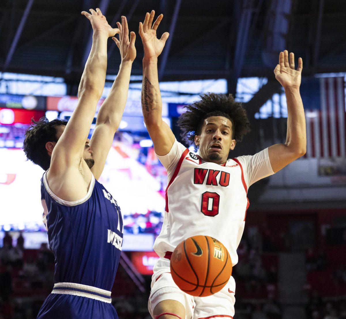 WKU guard Braxton Bayless (0) looks to a loose ball during the Hilltopper's game against the Kentucky Wesleyan Panthers in Bowling Green, Ky. on Saturday, Dec. 21, 2024.