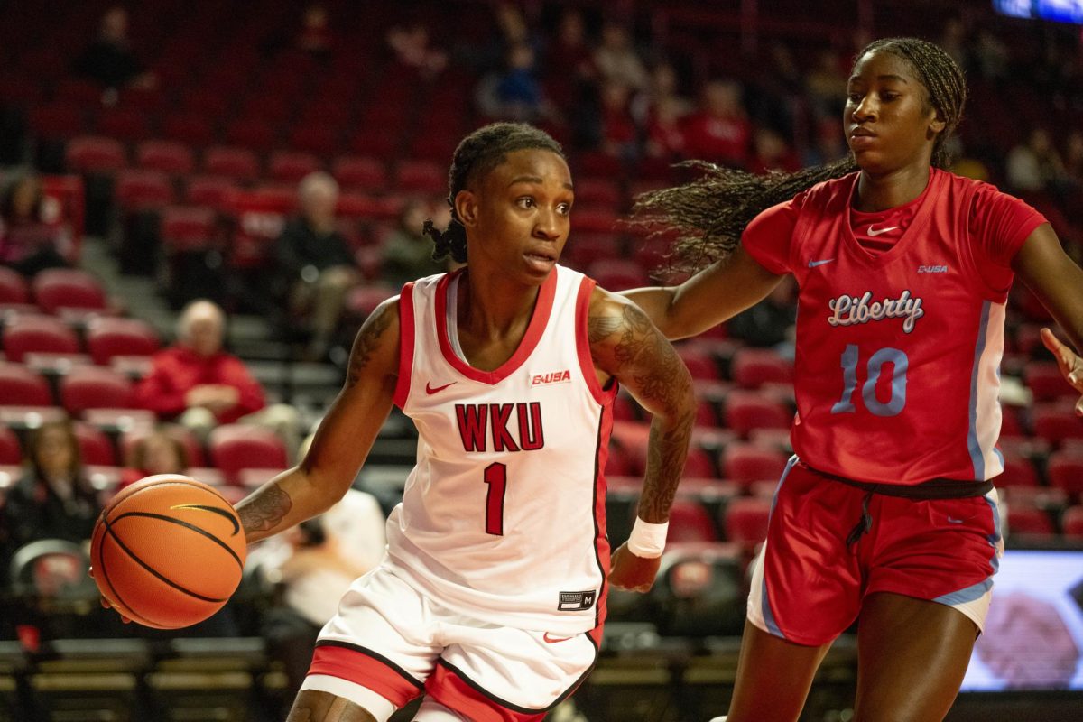 WKU guard Destiny Salary (1) drives the ball during the Lady Topper's game against the Liberty Flames in Bowling Green, Ky. on Thursday, Jan. 2, 2025.