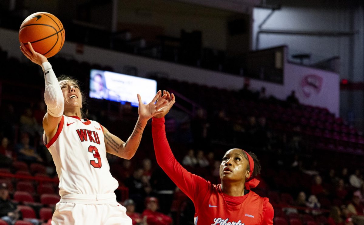 WKU guard Alexis Mead (3) attempts a layup during the Lady Topper's game against the Liberty Flames in Bowling Green, Ky. on Thursday, Jan. 2, 2025.