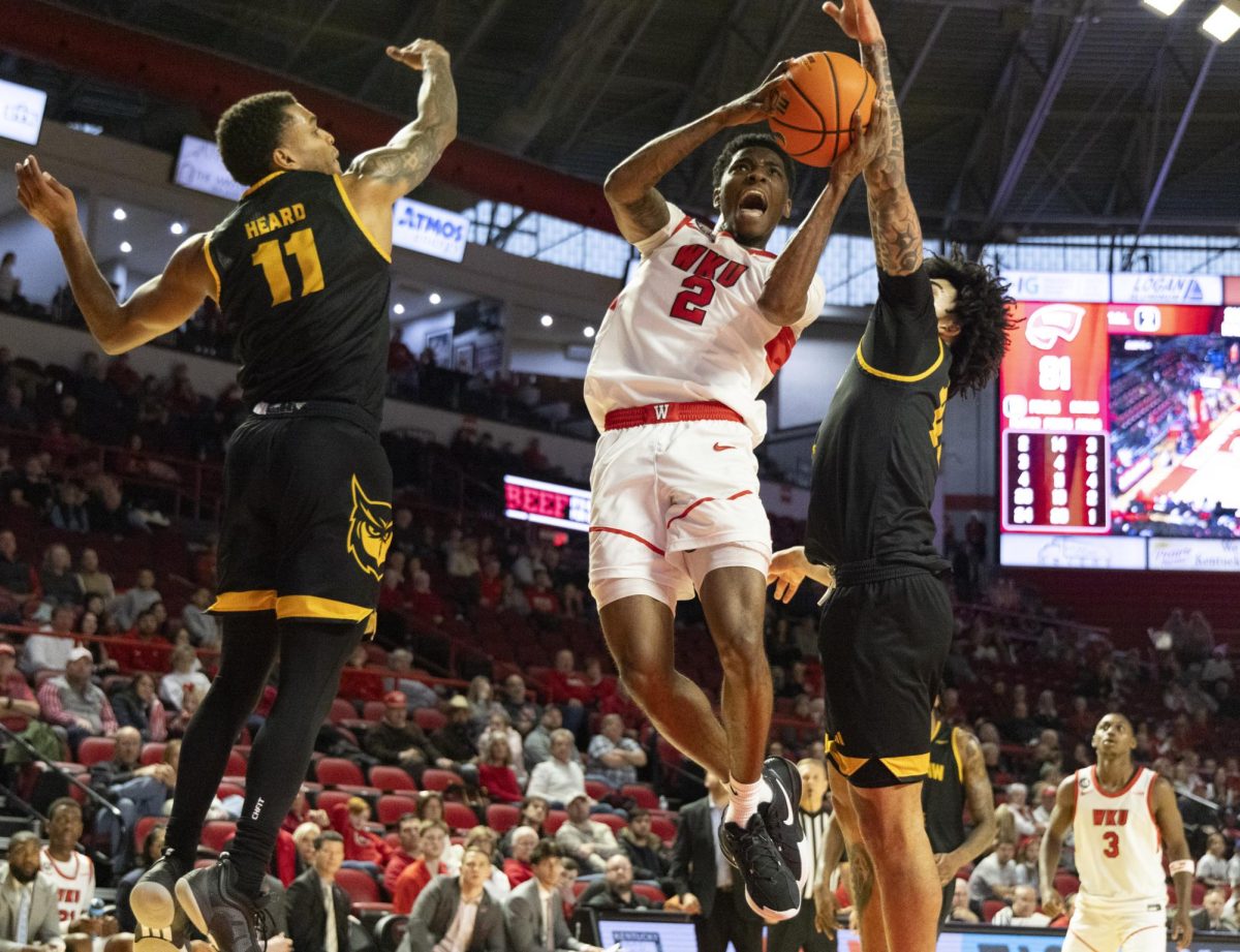 WKU guard Don McHenry (2) id fouled on his way to the basket during the Hilltopper's game against the Kennesaw State Owls in Bowling Green, Ky. on Saturday, Jan. 11, 2025.