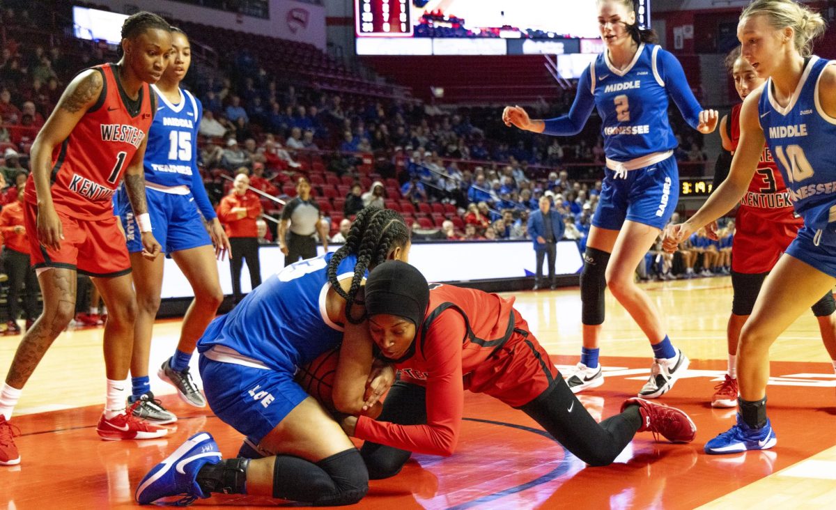 WKU forward Mariama Sow (6) and Lady Raider guard Jada Harrison (23) battle for a jump ball during the Lady Topper's game against the Middle Tennessee Lady Raiders in Bowling Green, Ky. on Saturday, Jan. 18, 2025.