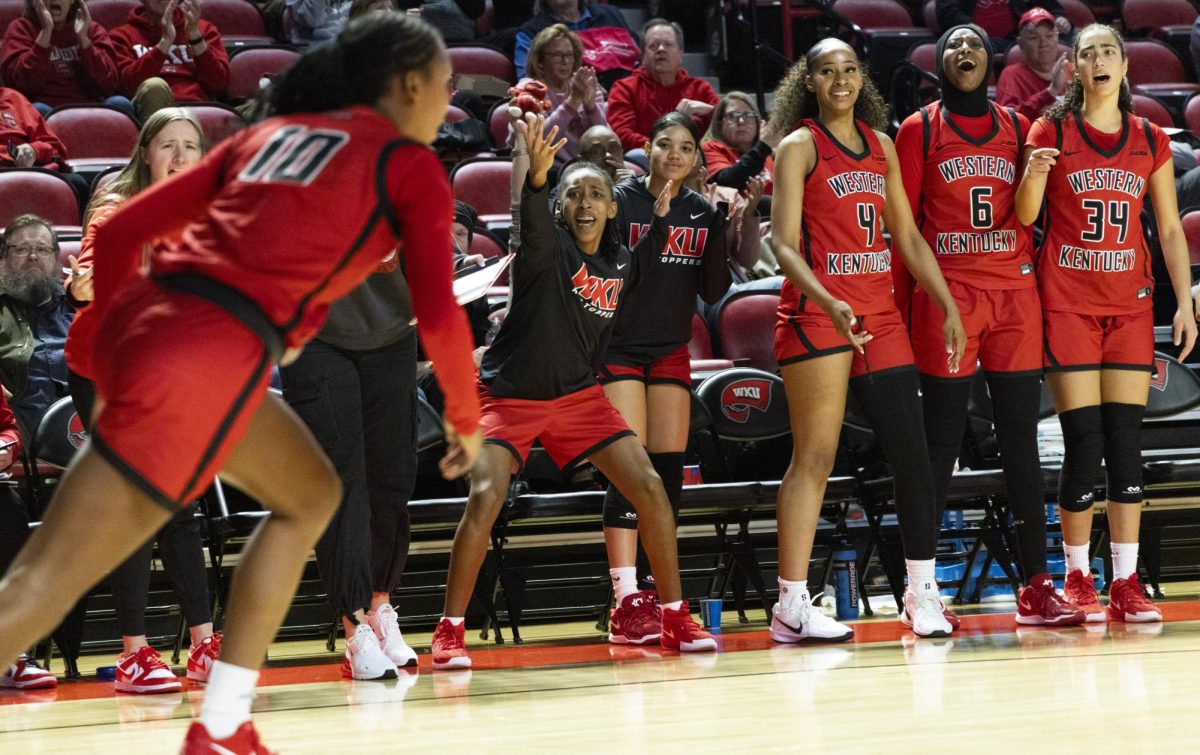 The Lady Toppers bench celebrate a play by their teammate, Acacia Hayes (10), during the Lady Topper's game against the Middle Tennessee Lady Raiders in Bowling Green, Ky. on Saturday, Jan. 18, 2025.