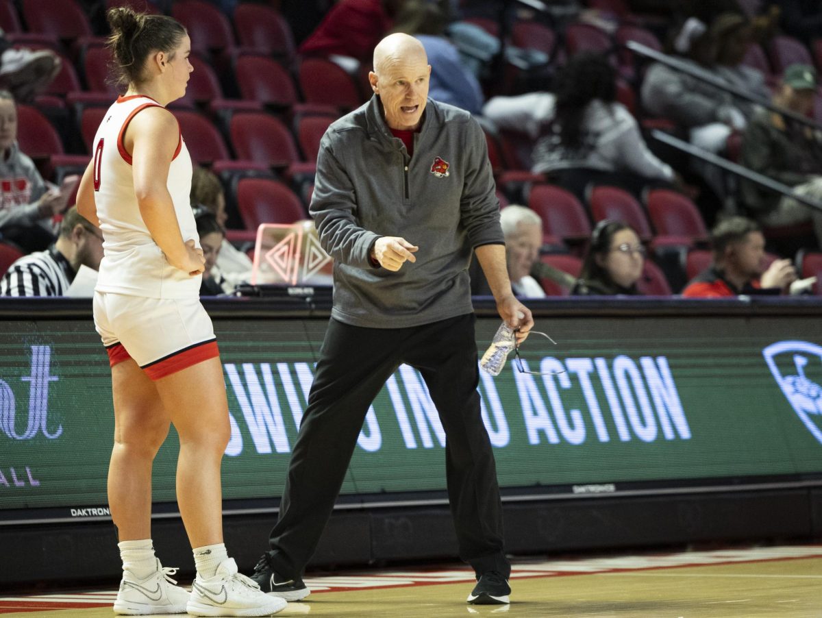 WKU head coach Greg Collins coaches guard Mackenzie Chatfield (0) during the Lady Topper's game against the Sam Houston Bearkats in Bowling Green, Ky. on Saturday, Jan. 25, 2025.