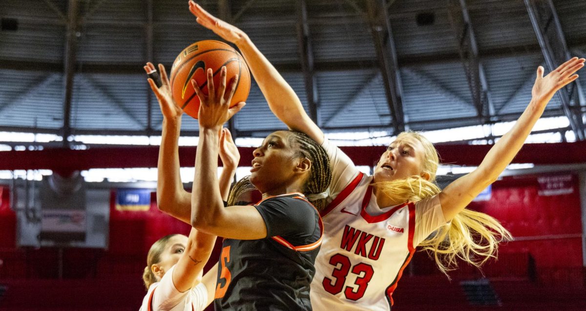 Sam Houston guard Aysia Ward-Strong (5) shoots the ball while being defended by Western Kentucky guard Josie Gilvin (33) during the Lady Topper's game against the Sam Houston Bearkats in Bowling Green, Ky. on Saturday, Jan. 25, 2025.